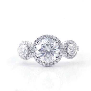 Round Brilliant Cut Moissanite with Two Round Smaller Side Stones Pavé White Gold Ring