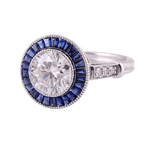 Round Cut White Moissanite with Trapezoid Blue Moissanite Halo with Milgrain and Side Stones White Gold Ring