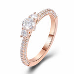 Round Cut Moissanite with Round Side Stones Triple Pave Rose Gold Ring