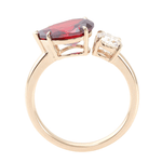 Pear Cut Lab Grown Ruby with Round Cut White Moissanite Toi et Moi Yellow Gold Ring
