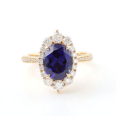 Oval Cut Blue Sapphire Halo Pavé Yellow Gold Ring