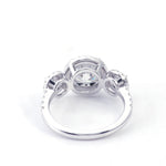 Round Brilliant Cut Moissanite with Two Round Smaller Side Stones  Pavé White Gold Ring