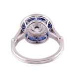 Round Cut White Moissanite with Trapezoid Blue Moissanite Halo with Milgrain and Side Stones White Gold Ring