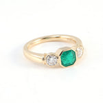 Asscher Green Emerald with Two White Moissanite Yellow Gold Ring