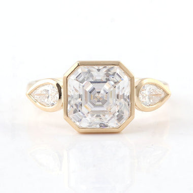 Asscher Cut Moissanite with Pear Side Stones Bezel Yellow Gold Ring